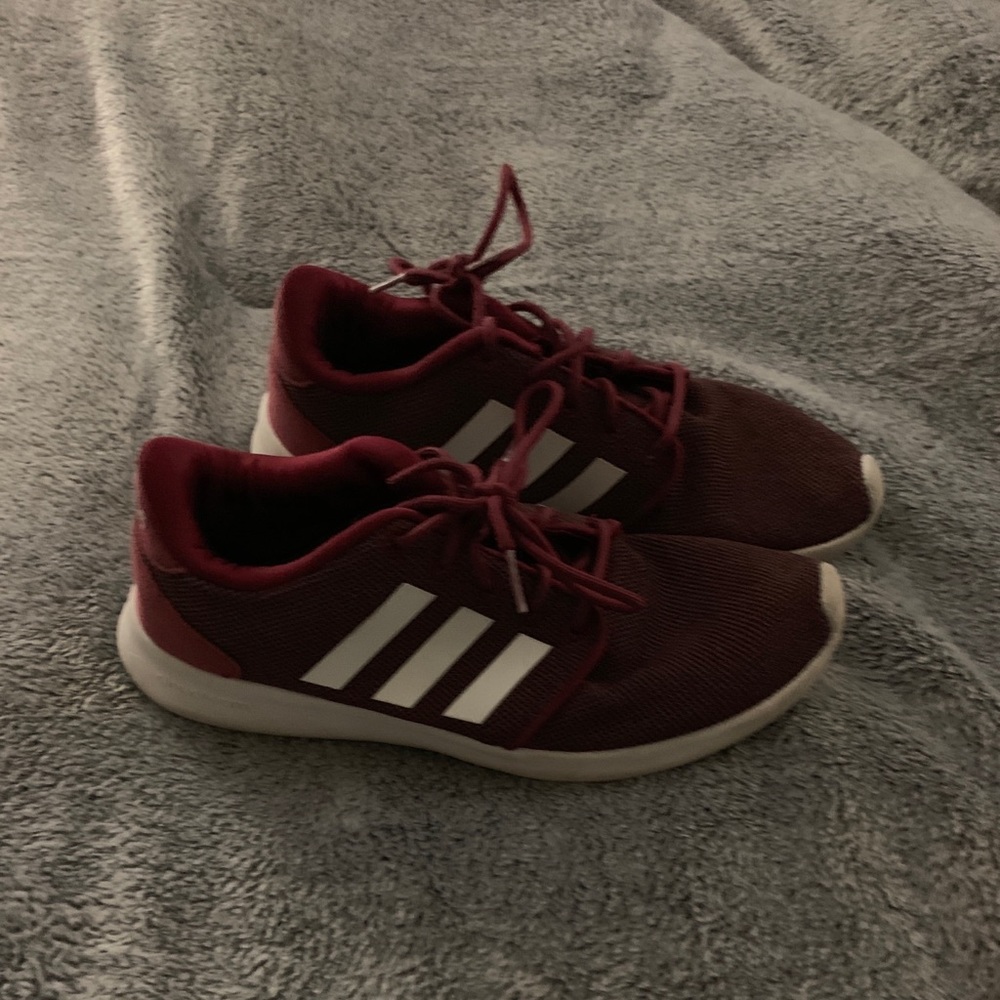 Wine colored adidas three stripe sneakers